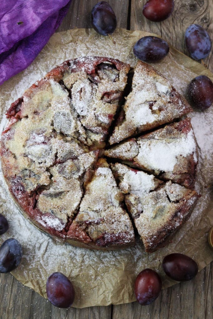 Buckwheat plum clafoutis slices, dusted with powdered sugar and ready to enjoy.